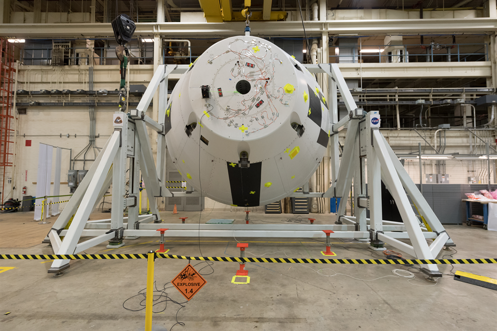 The 22,000-pound AA-2 test vehicle undergoing weight and center of gravity testing using a specially designed cradle.